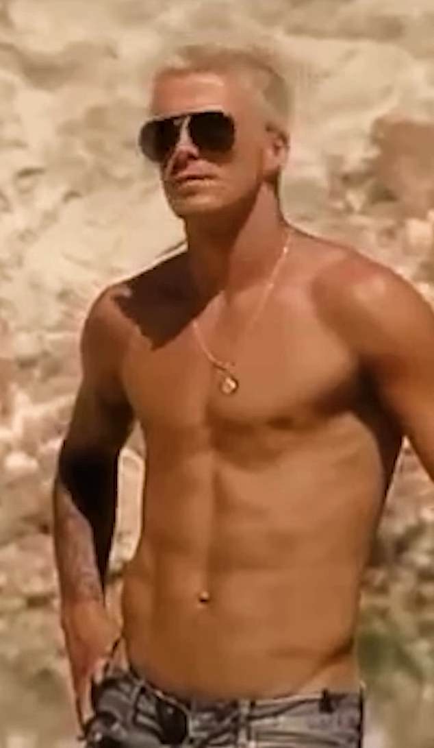 The shirtless theme continued with a throwback snap of David showing off his toned figure